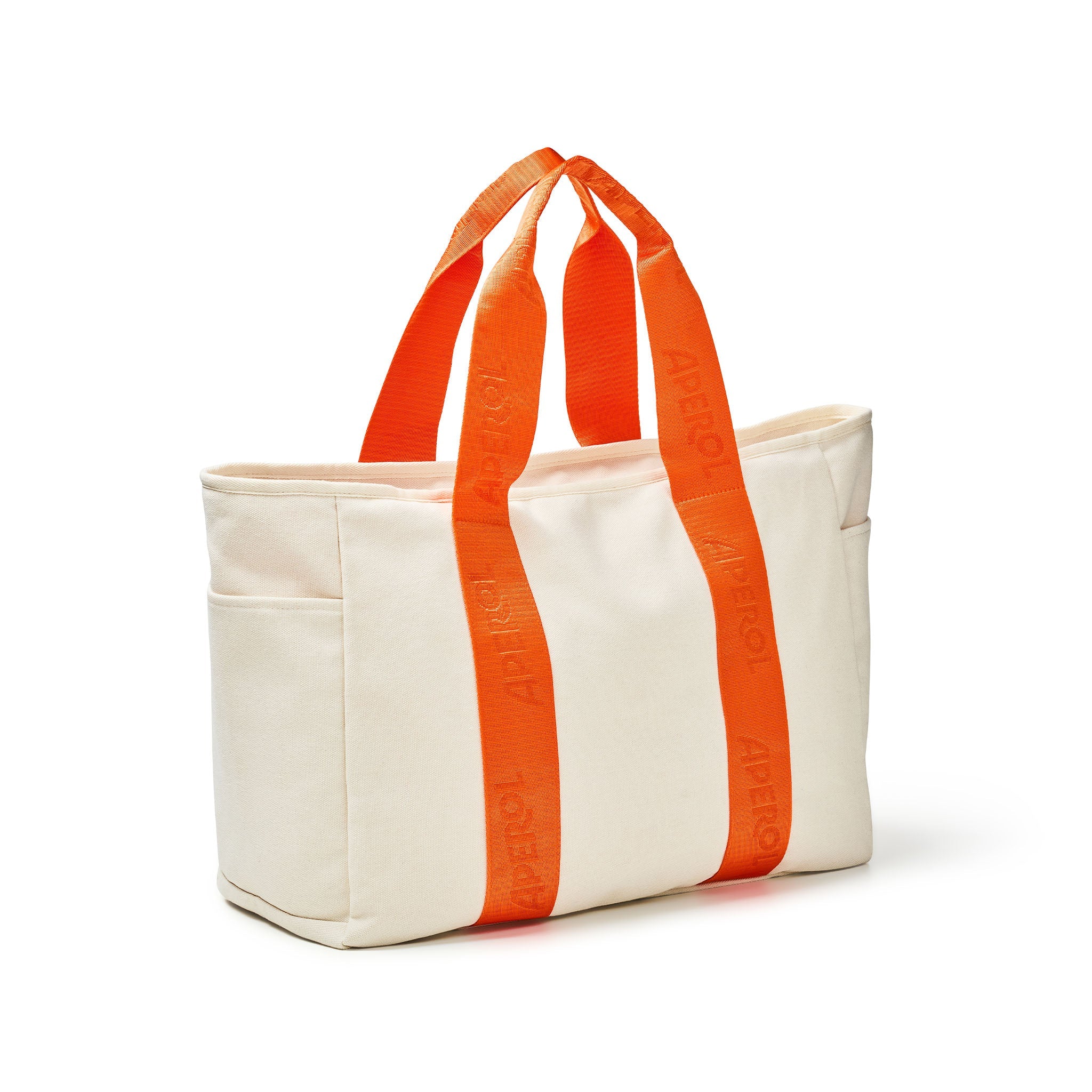 An off-white canvas tote bag with bright orange webbed shoulder straps featuring the brand name 'APEROL' on webbing orange straps, shown on a clean white background.