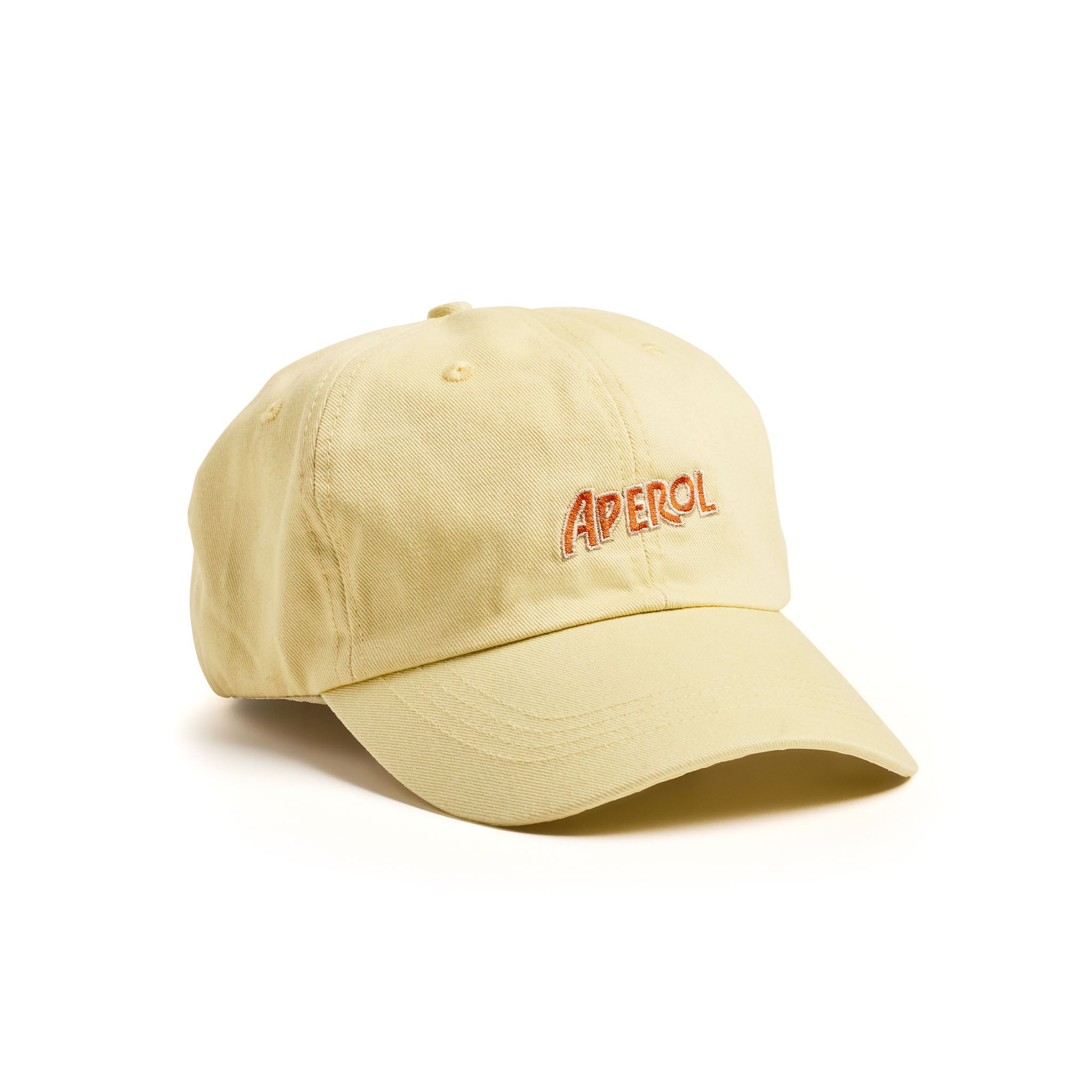 A pale yellow cotton cap with 'APEROL' embroidered in red on the front, set against a plain white background.