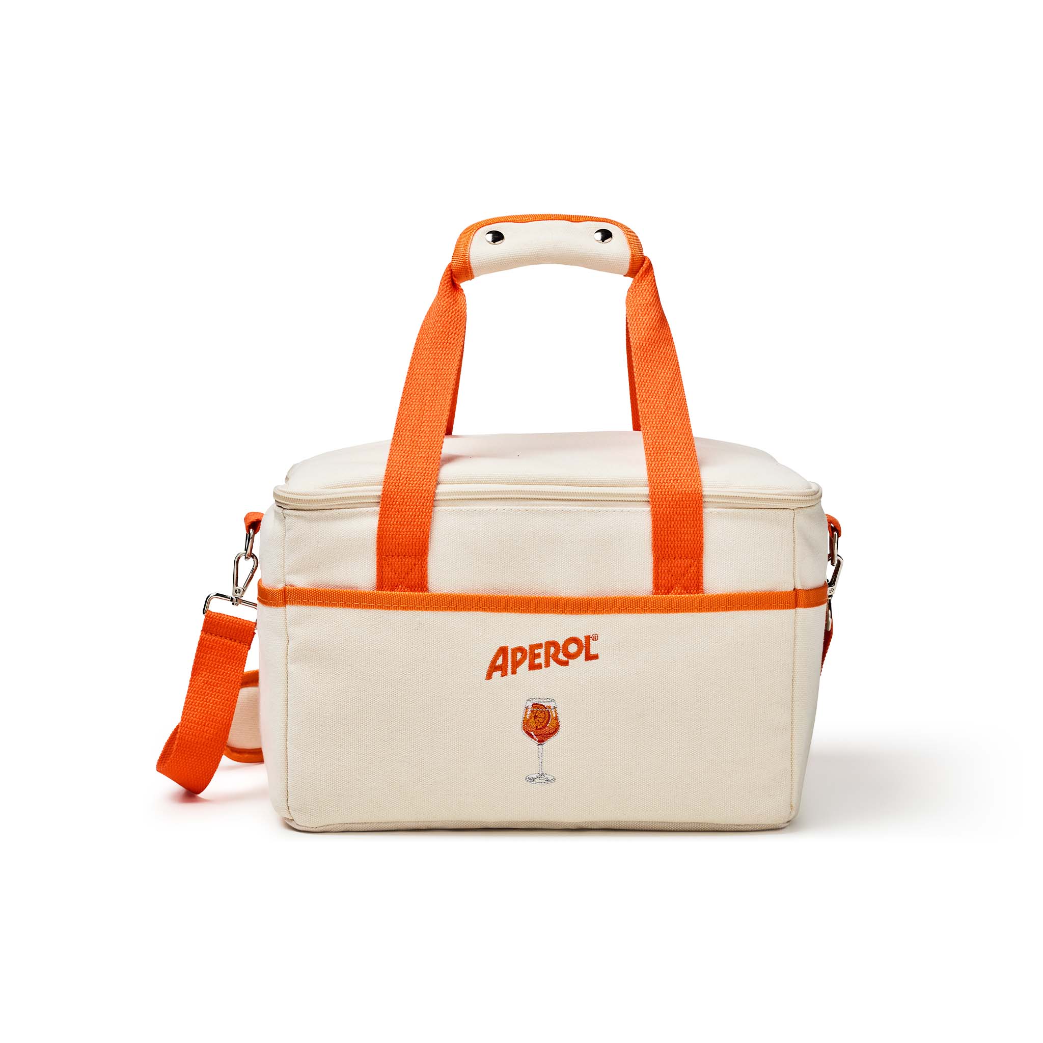 An off-white canvas cooler bag with bright orange handles, zipper trim, and branding. The brand name 'APEROL' is printed in orange on the front, above a small Aperol glass graphic.