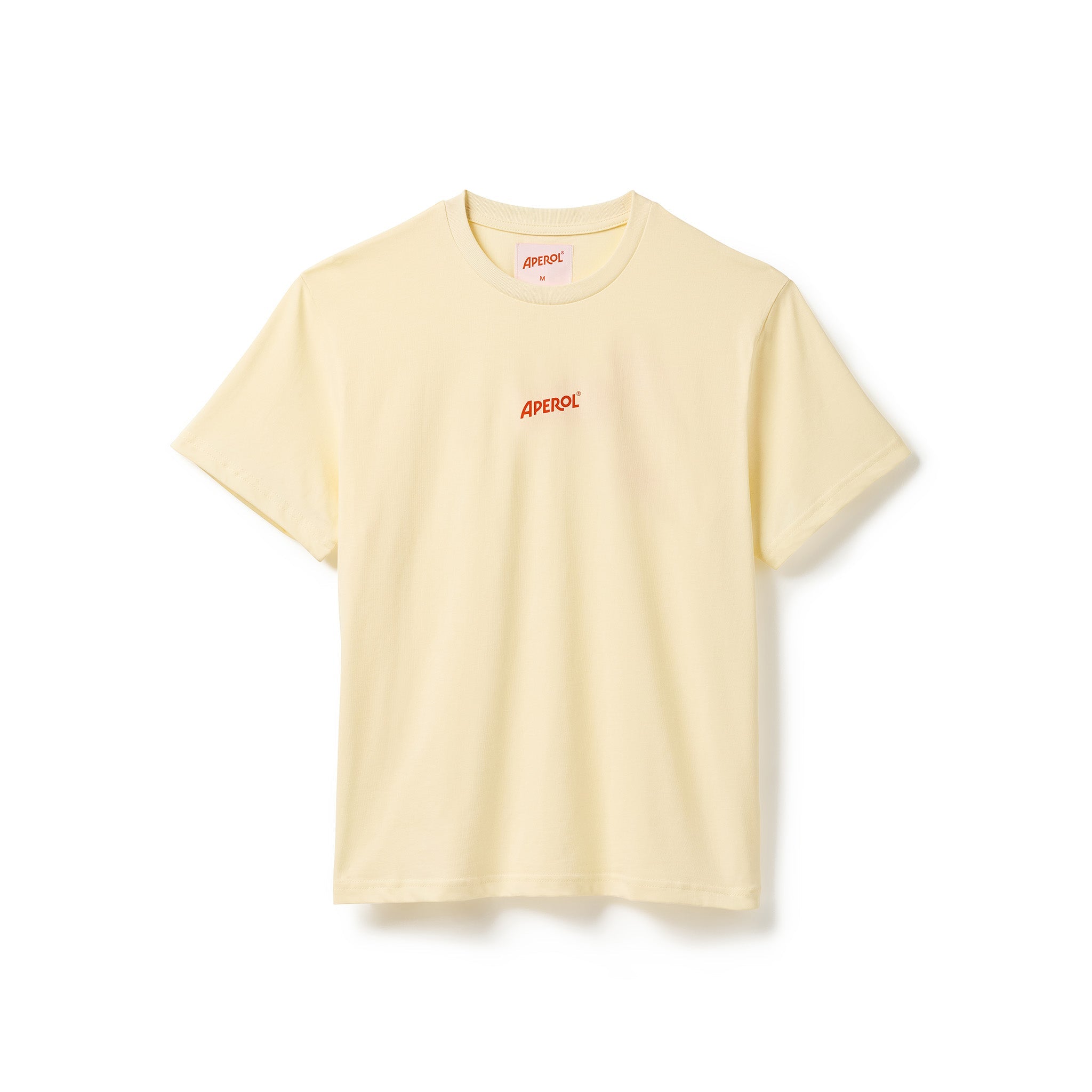A pale yellow crewneck t-shirt with a small orange 'APEROL' logo printed in middle chest, displayed flat against a clean white background.