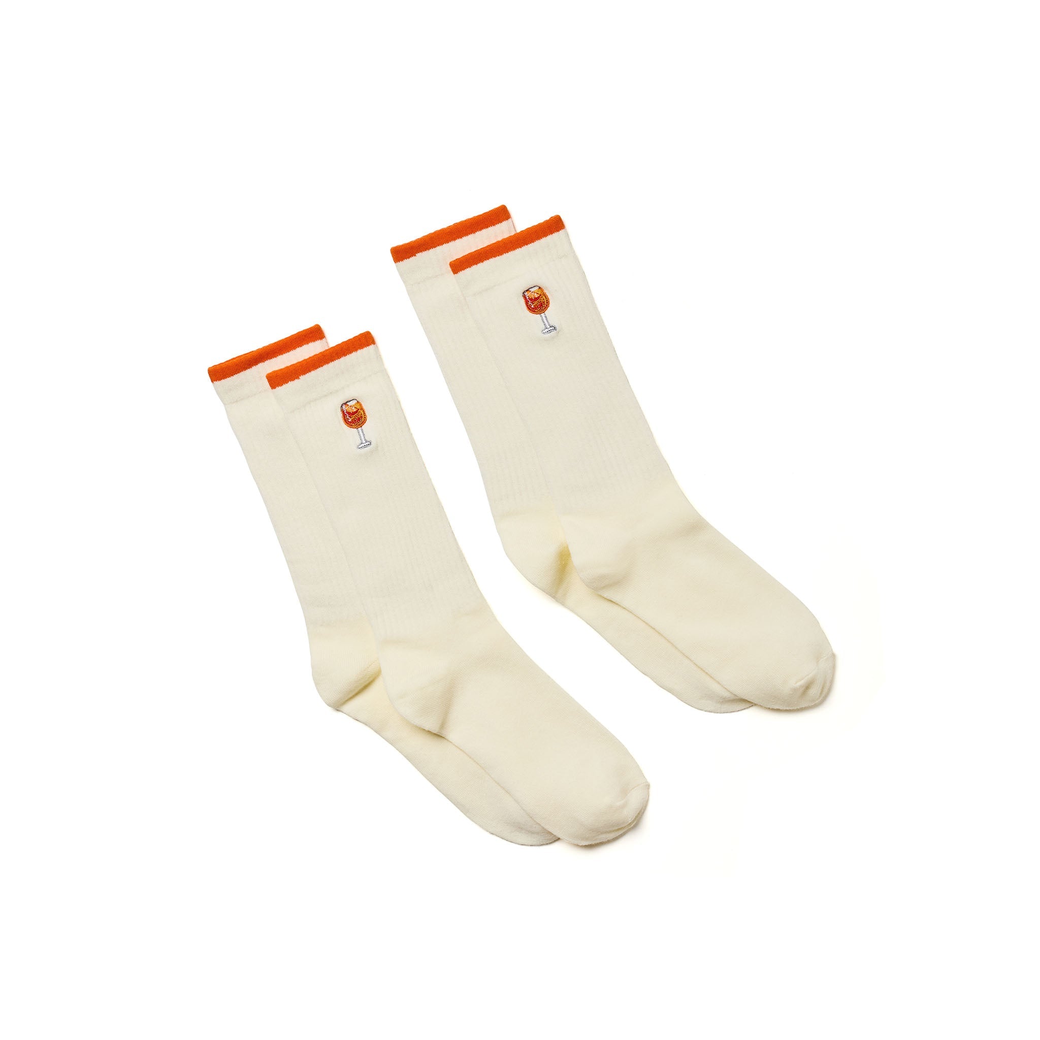 A pair of cream-colored crew socks with bright orange ribbed cuffs and a small embroidered orange and white graphic on the side, displayed on a clean white background.