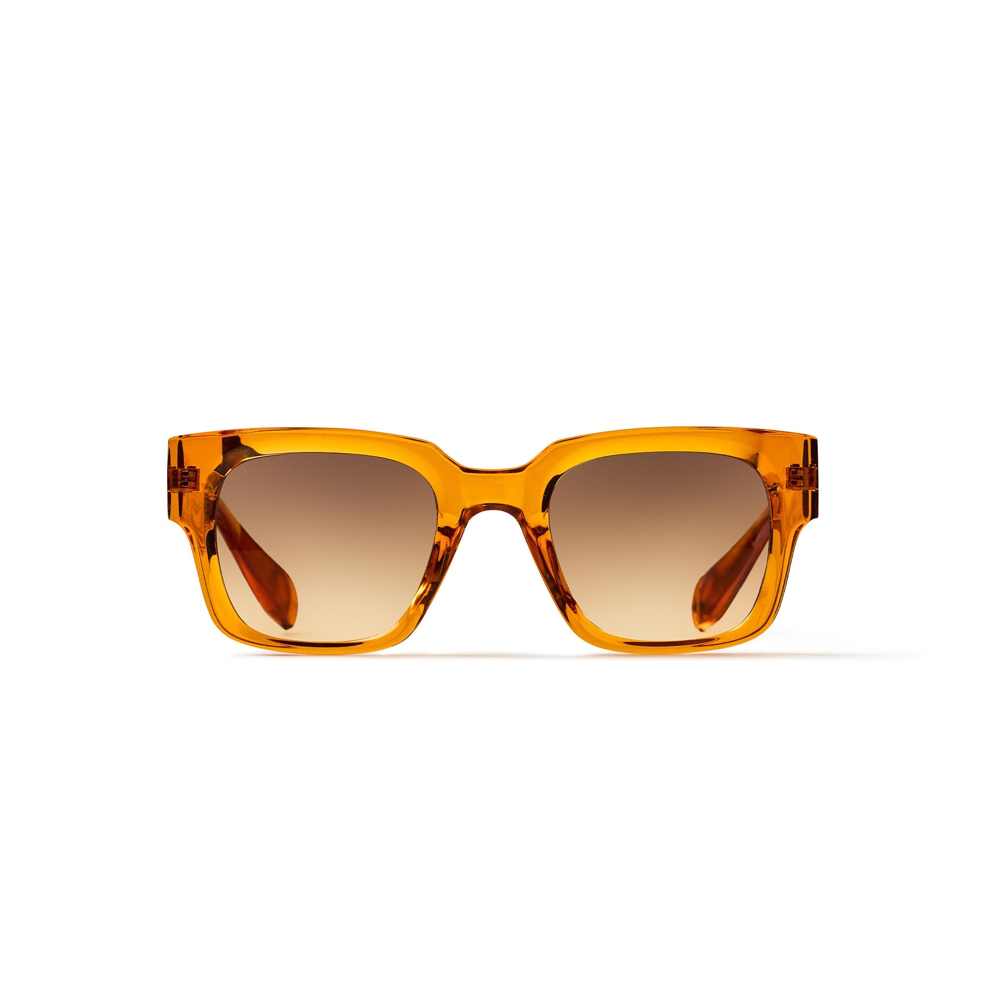 A pair of chunky square sunglasses with a translucent amber-orange acetate frame and brown gradient lenses, shown against a plain white background.