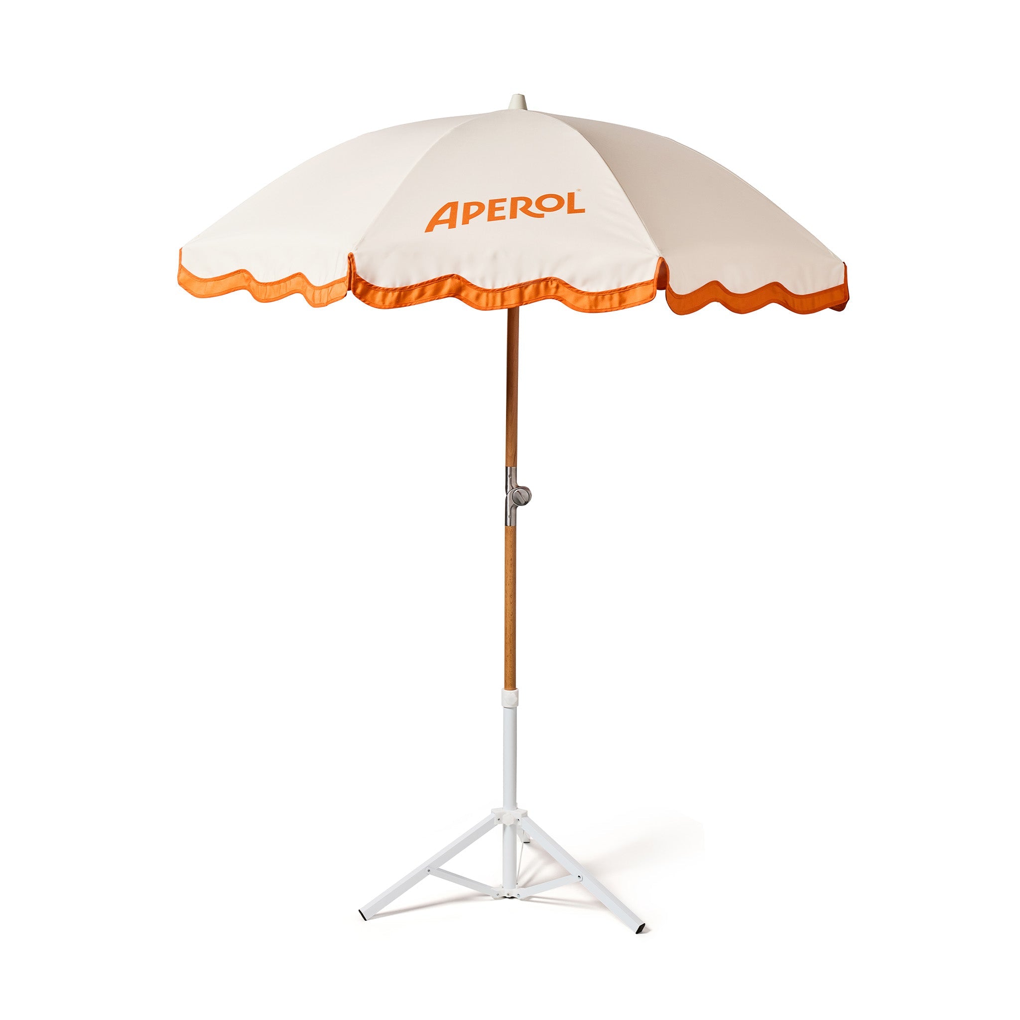 A cream and orange APEROL outdoor umbrella with a wooden pole and white tripod base, shown on a solid white background.